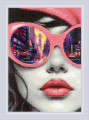 Big City Rhythm cross stitch kit featuring a close-up of a woman's face with pink sunglasses reflecting a vibrant urban