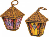 Lanterns cross stitch kit showing two miniature stitched lanterns in warm amber and rose tones